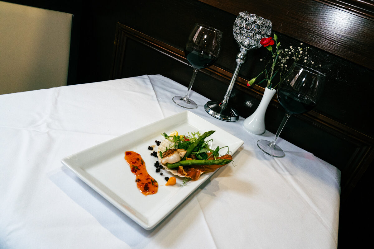 A plated starter with homemade bread and olive oil.